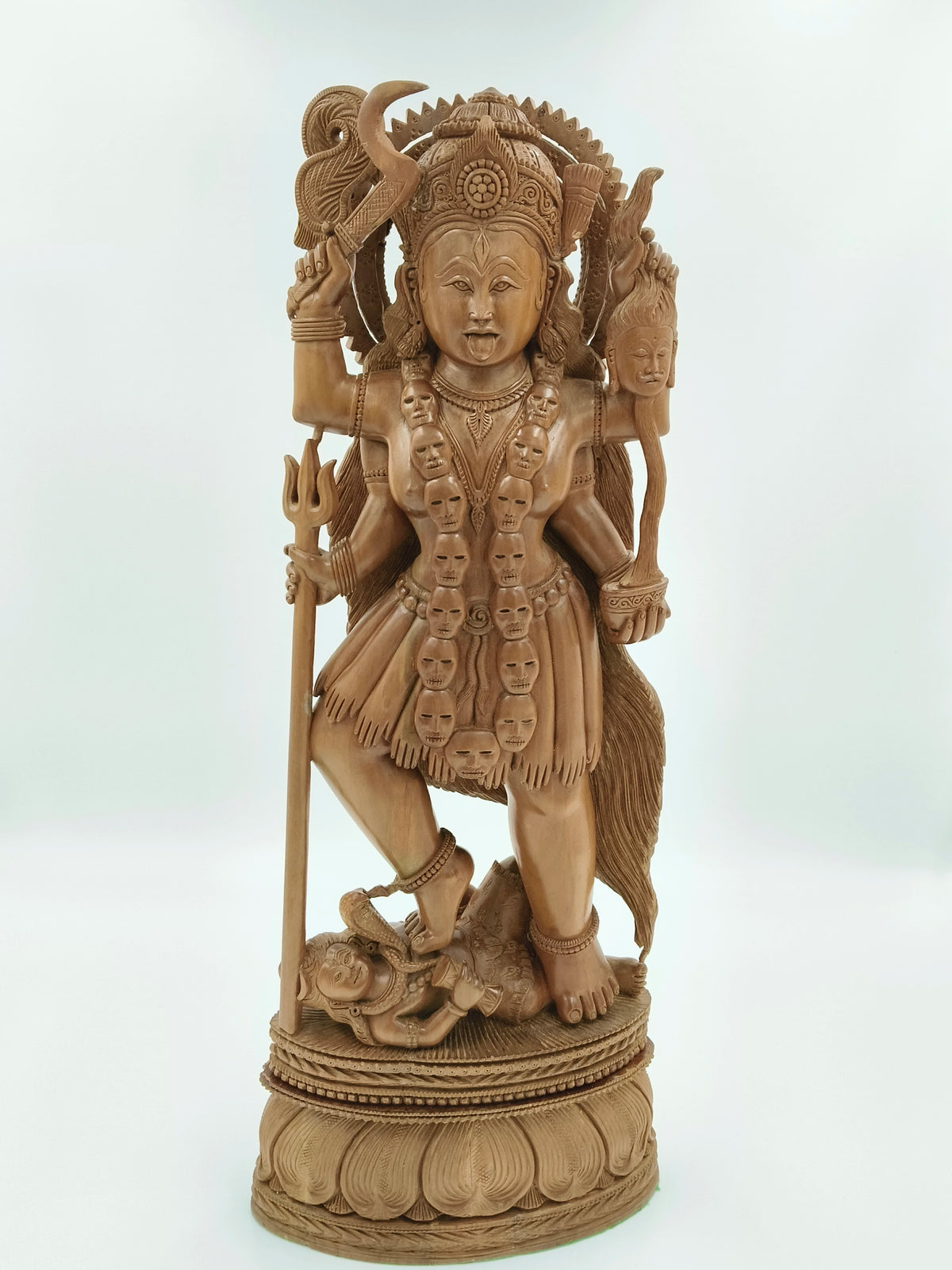 Large sandalwood statue of goddess Kalikamatha with multiple arms and intricate details