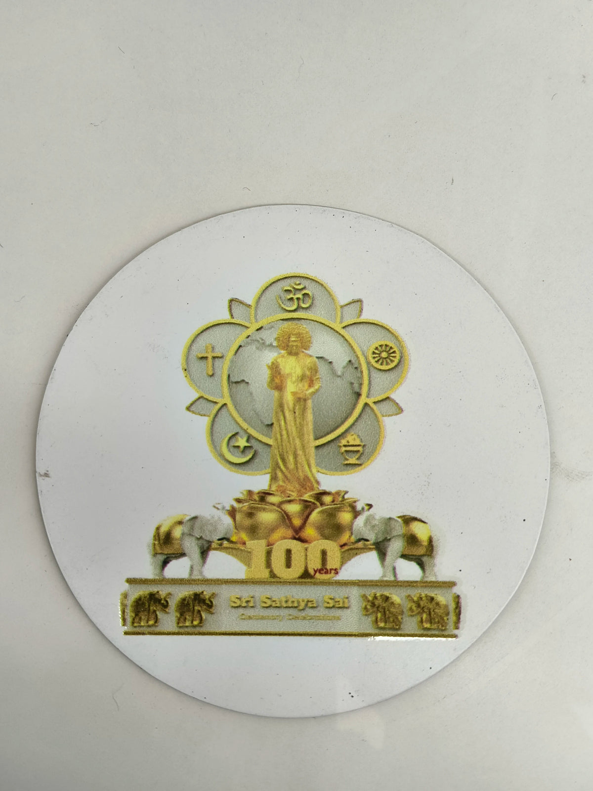 Large round motivational fridge magnet featuring Sri Sathya Sai with religious symbols and elephants
