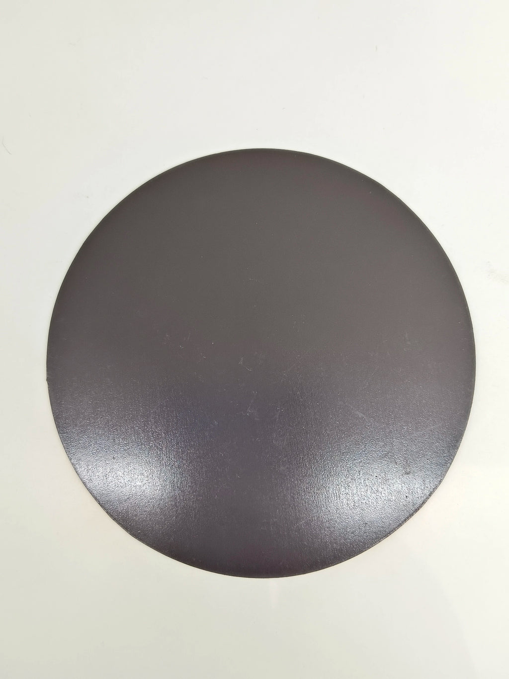 Large round black motivational fridge magnet with smooth matte surface