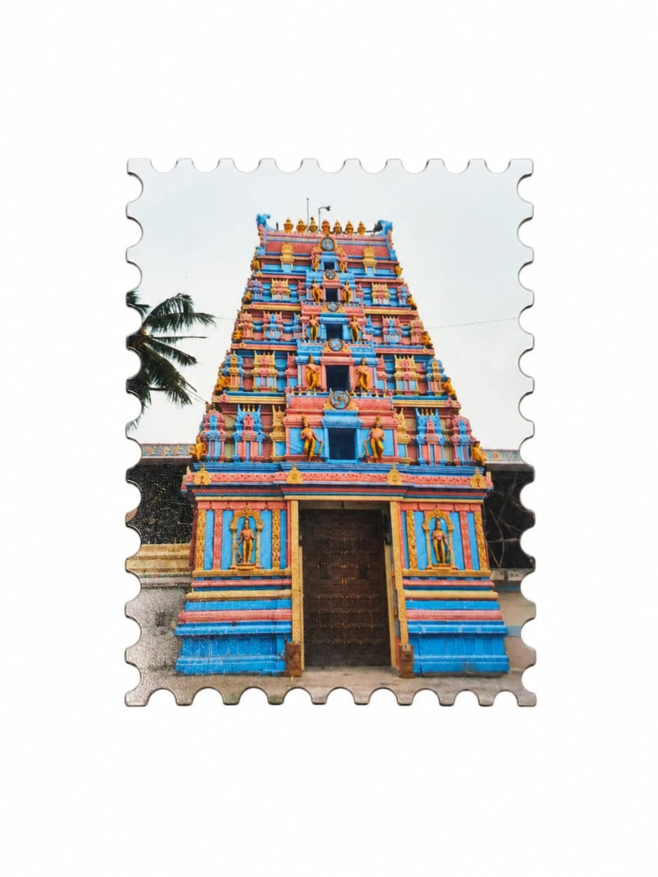 Small colorful Gopuram temple tower fridge magnet with detailed carvings