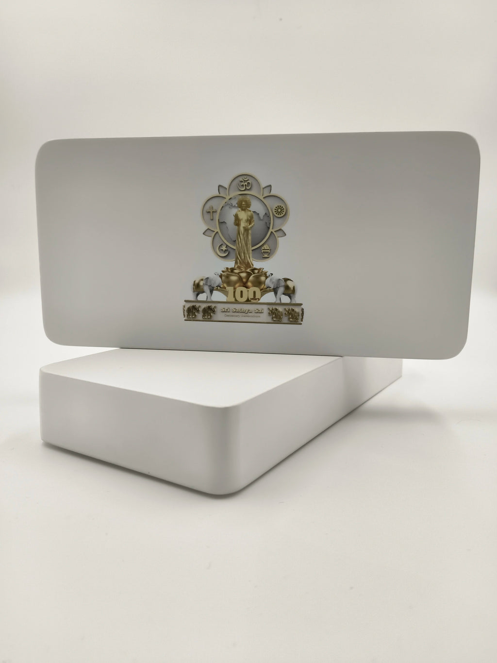 Wooden tabletop clock with Sri Sathya Sai Baba centenary logo and golden decorative elements