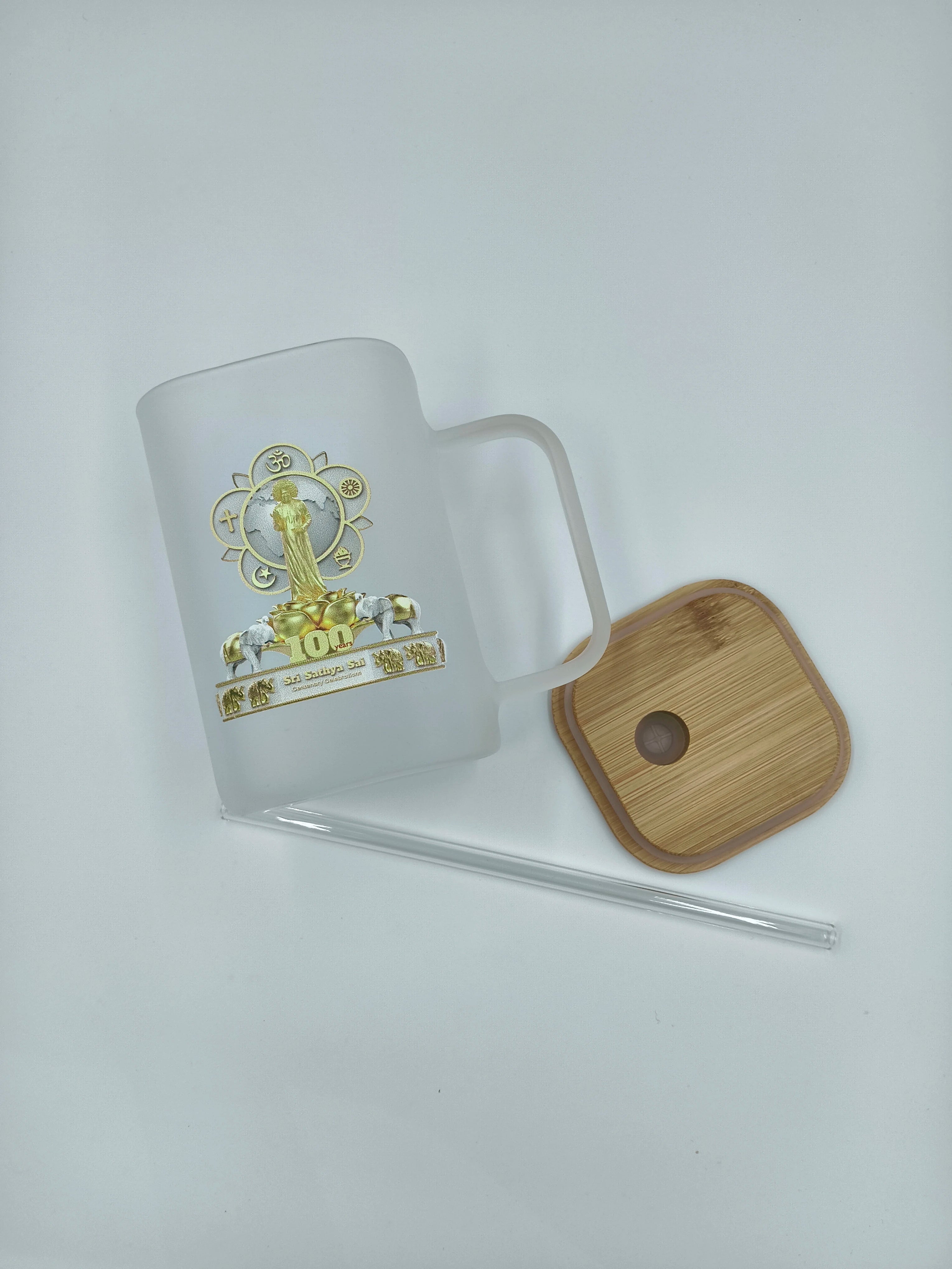 Frosted glass mug with Sri Sathya Sai centenary logo, bamboo lid, and glass straw