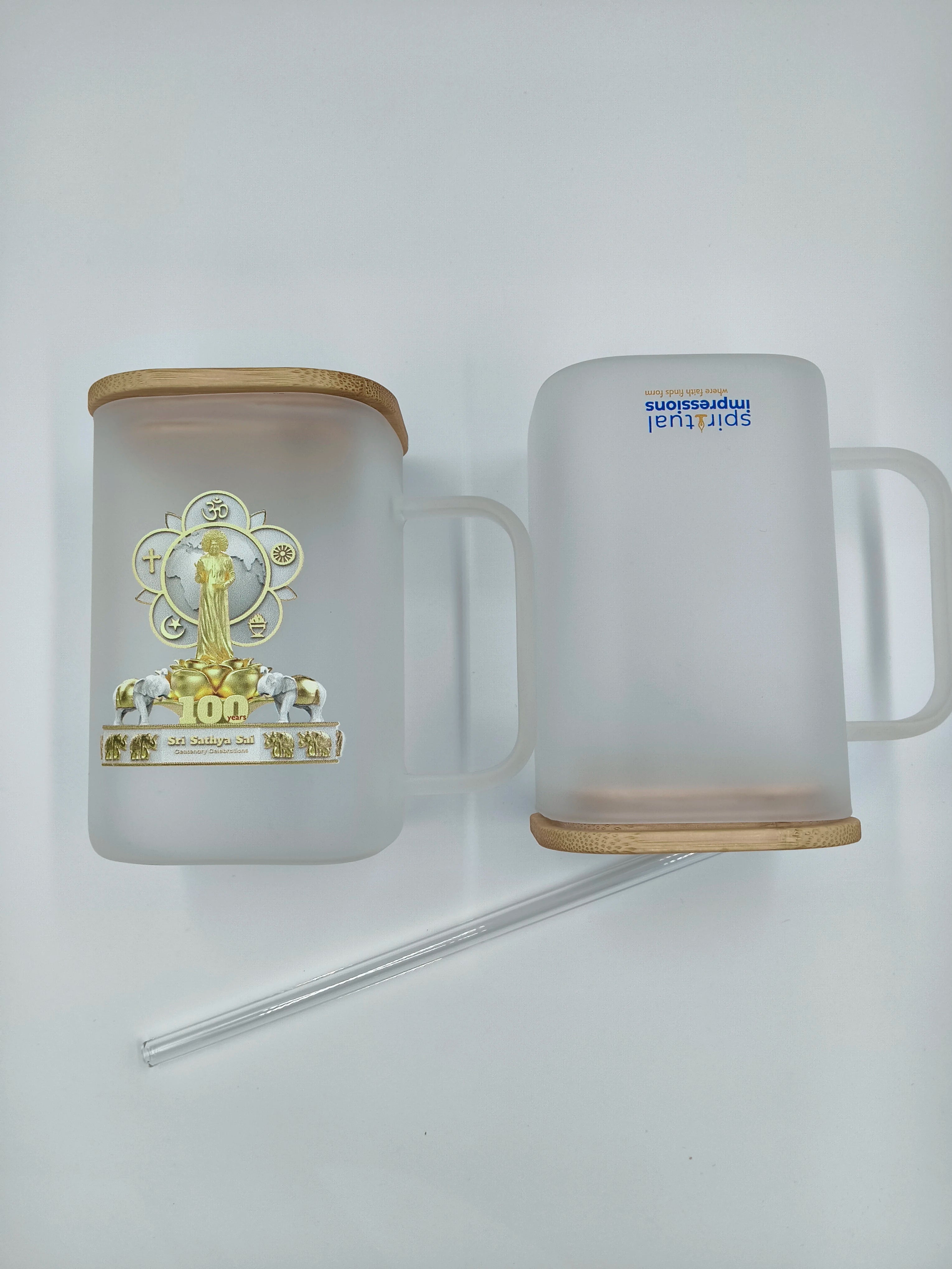 Frosted glass mug with wooden lid and straw featuring Sri Sathya Sai Centenary logo