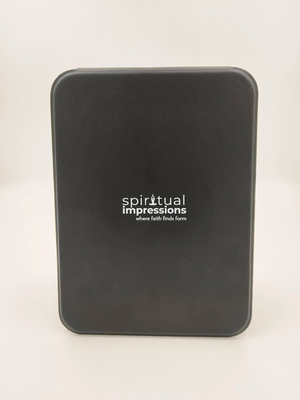 Closed black case with Spiritual Impressions logo on front