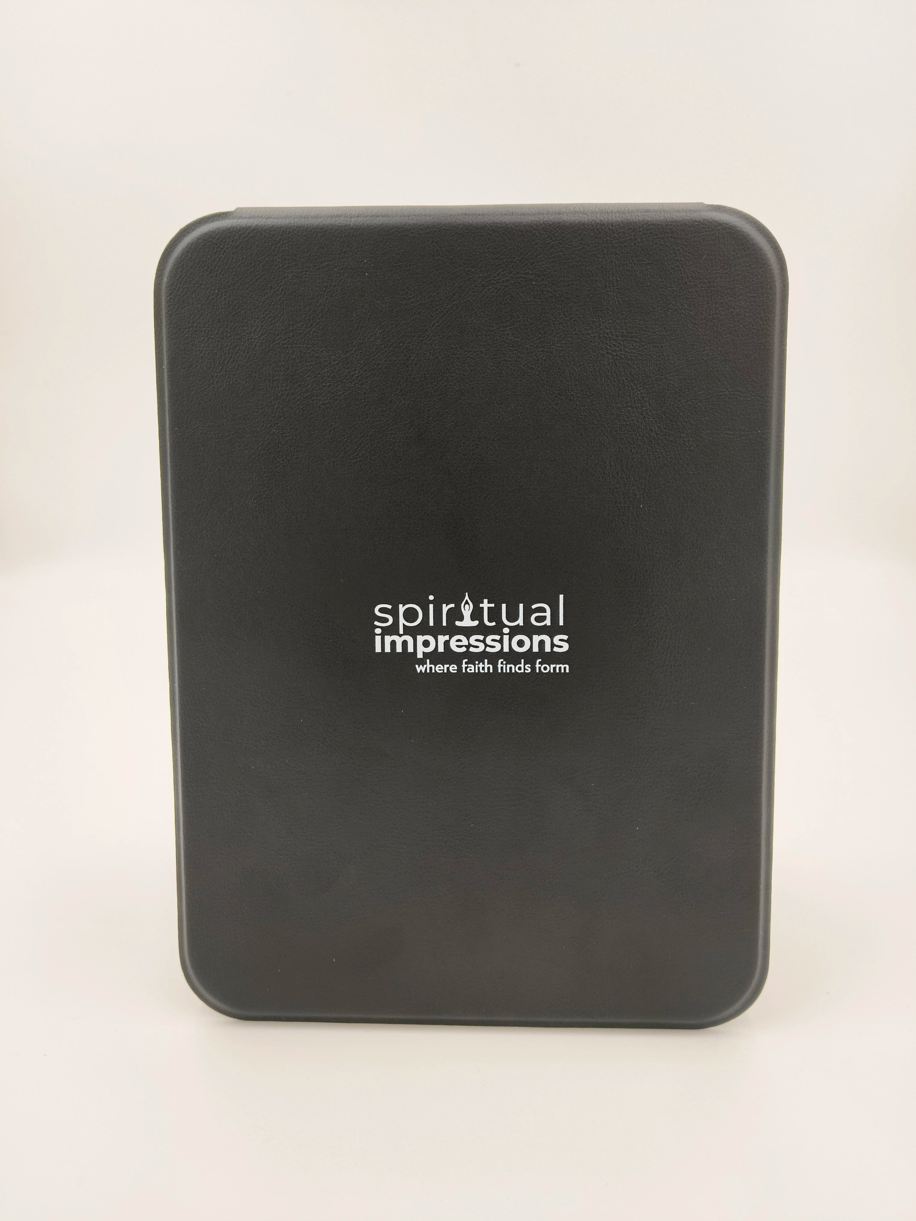 Closed black case with Spiritual Impressions logo on front