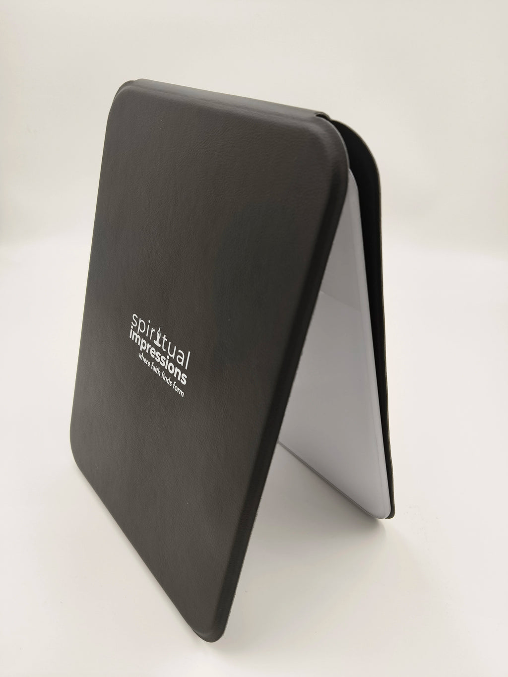 Black wooden board with Spiritual Impressions logo, standing angled