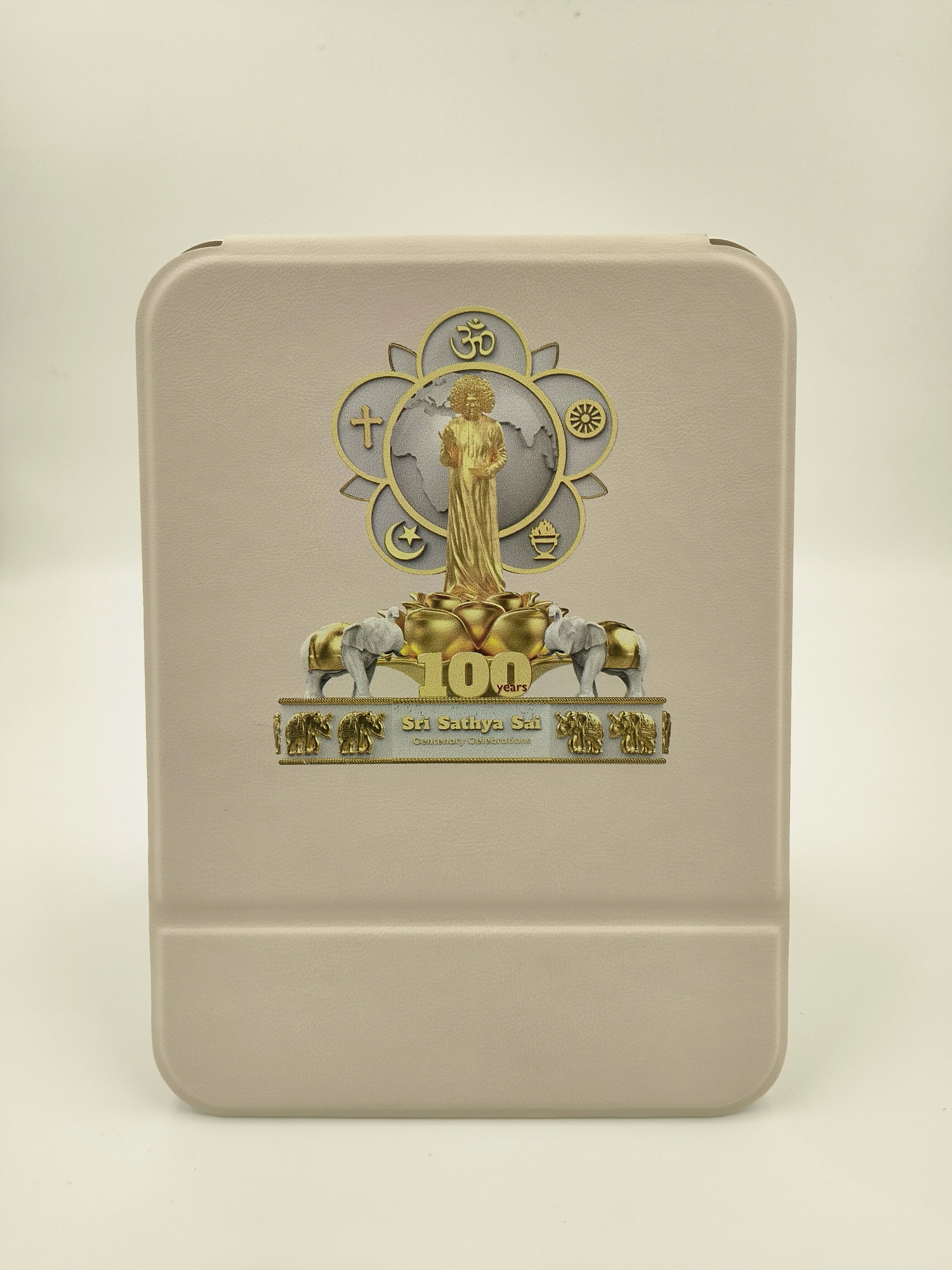 white board featuring Sri Sathya Sai Baba centenary celebration logo with gold and silver details
