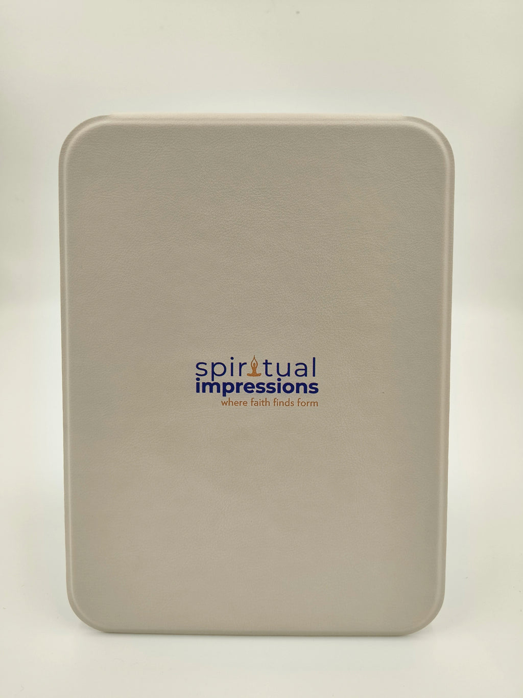 Closed beige white board box with Spiritual Impressions logo in center