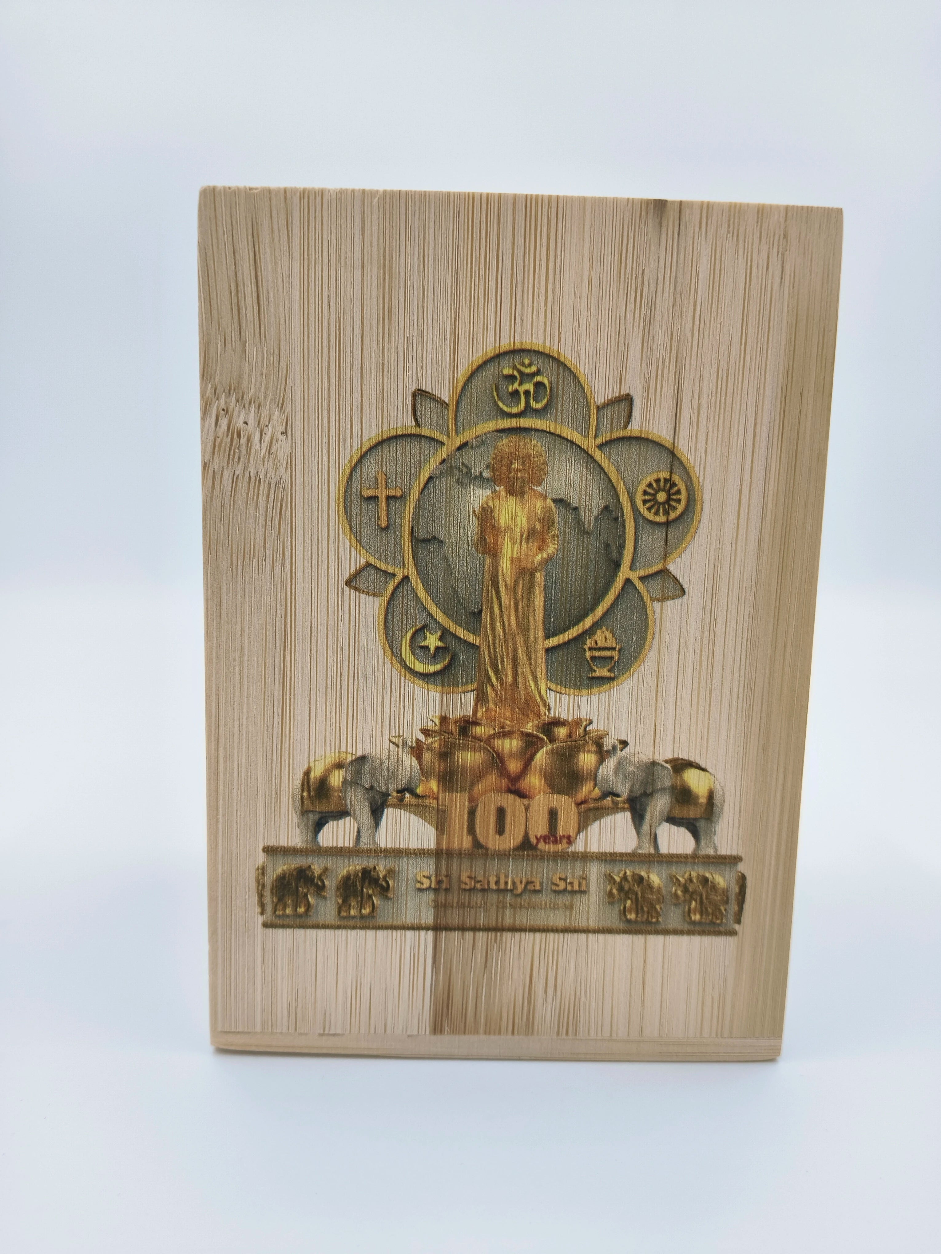 Large wooden pen stand featuring Sri Sathya Sai Centenary Celebrations logo