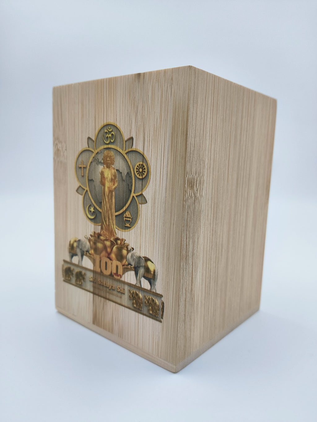 Wooden pen stand with Sri Sathya Sai Centenary Celebrations logo and elephant design