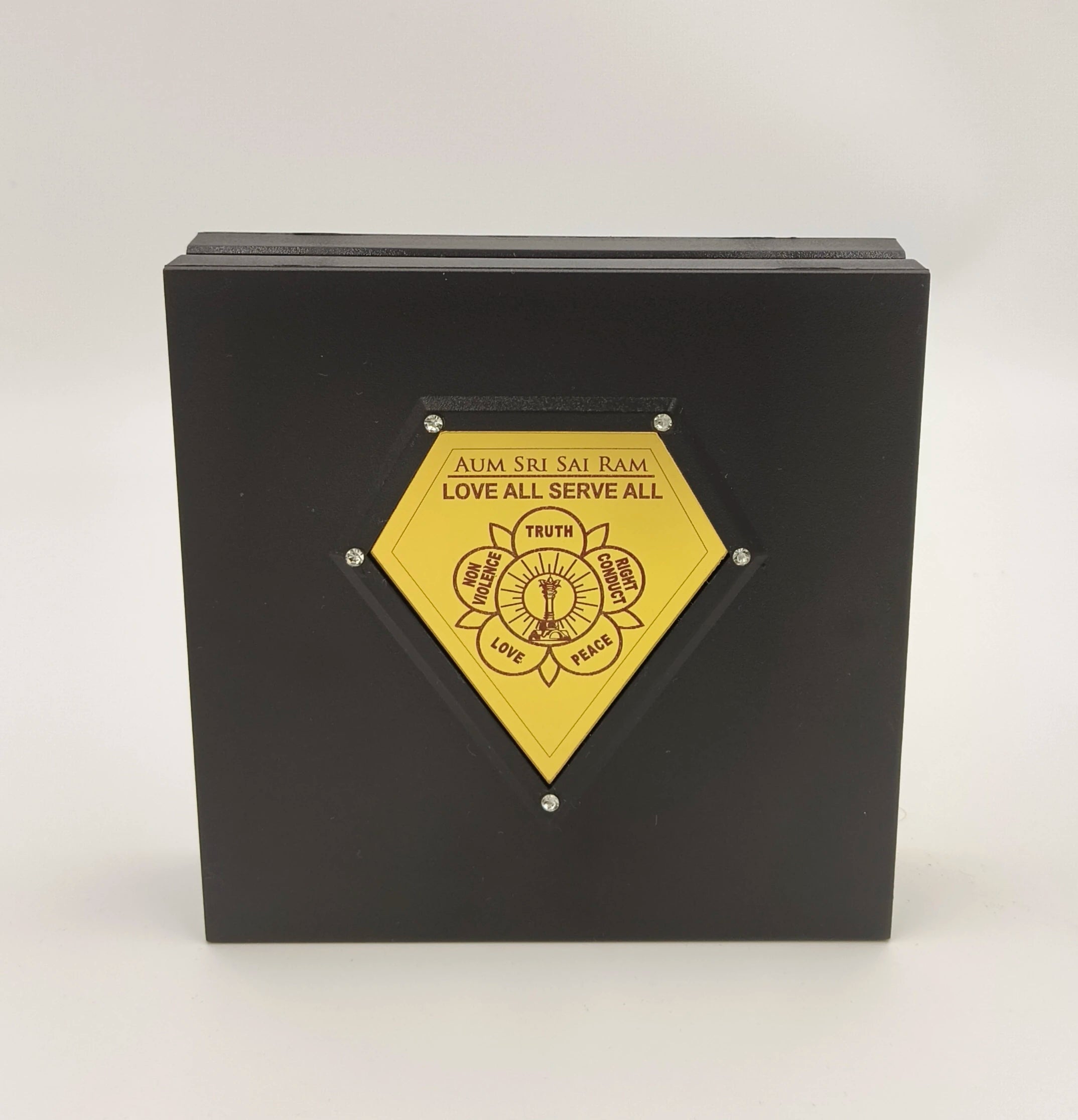 Black Sri Sathya Sai Baba Yantram plaque with yellow spiritual emblem and inscriptions