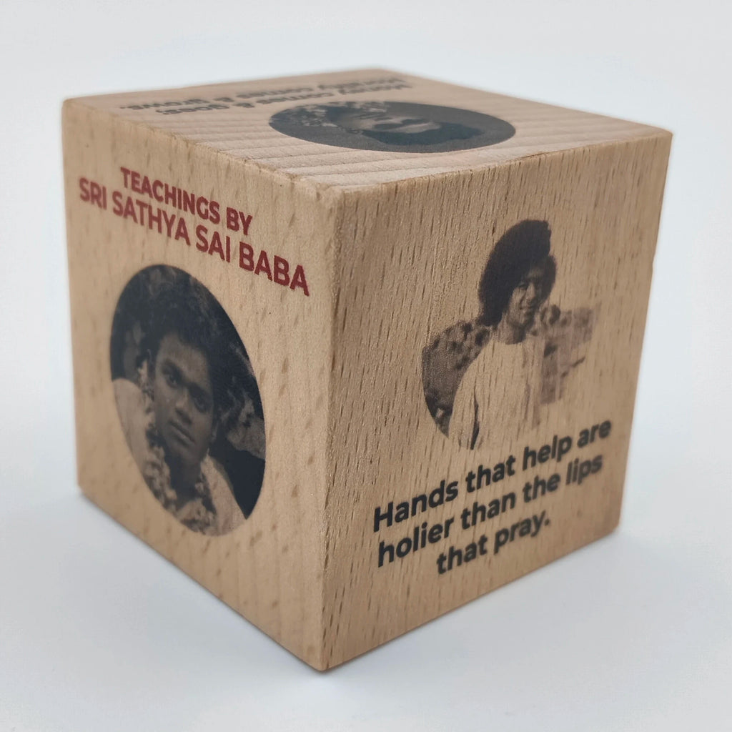 Mini wooden cube featuring teachings and images of Sri Sathya Sai Baba