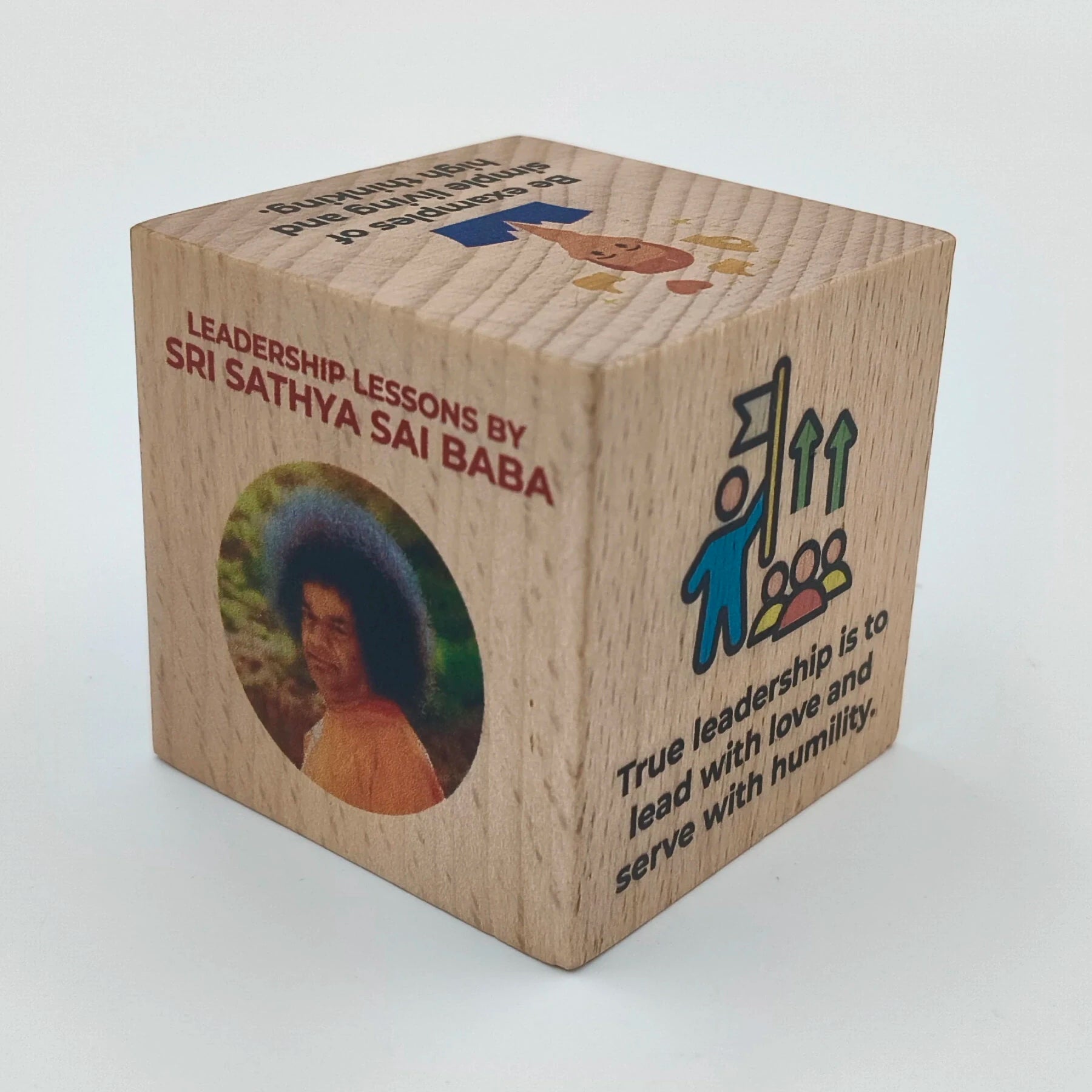Wooden cube with image of Sri Sathya Sai Baba and leadership quote