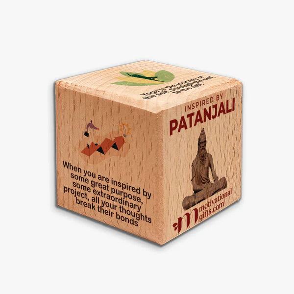 Inspirational wooden cube featuring Patanjali statue and motivational quotes