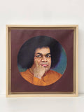 framed oil painting of Sai Baba with afro hairstyle on canvas