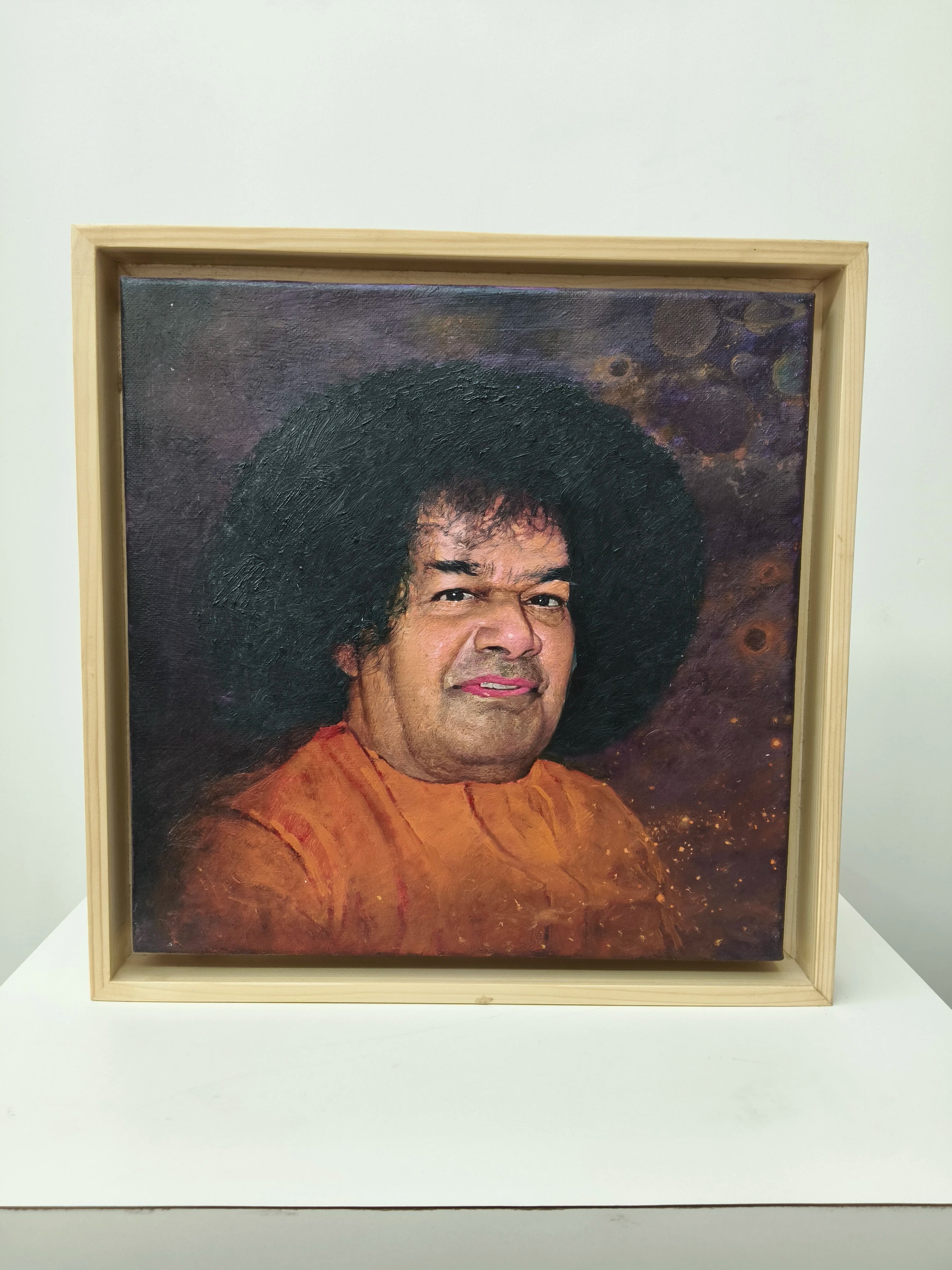 framed oil painting portrait of spiritual figure Sai Baba on canvas