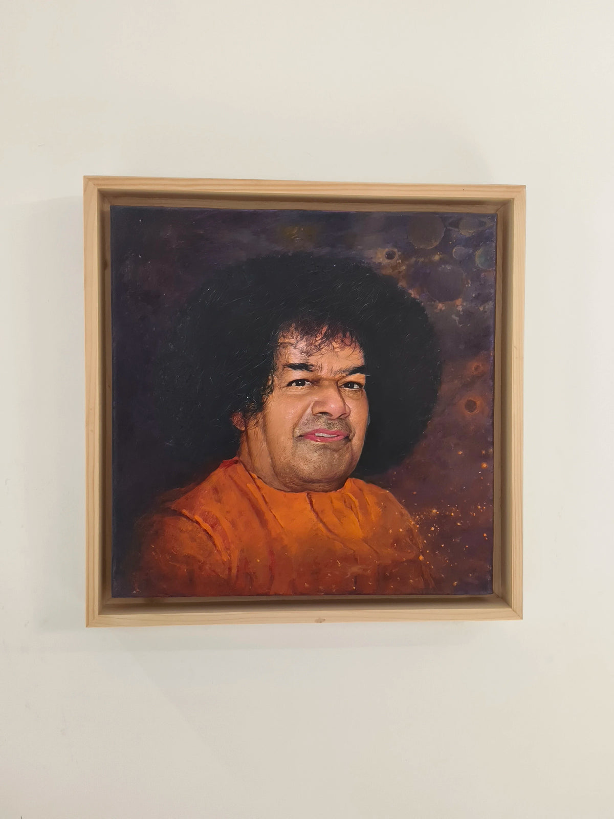 framed oil painting portrait of spiritual figure Sai Baba on canvas