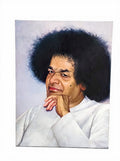 Large oil painting on canvas of Sai Baba with hand on chin against a muted background