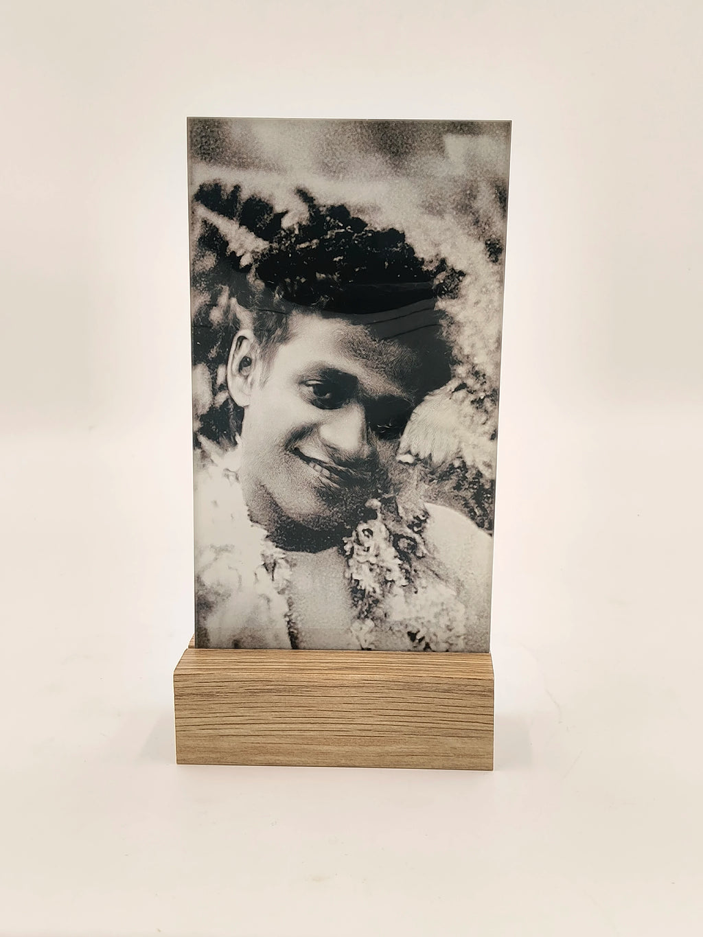 rectangular glass display panel with black and white portrait in wooden base