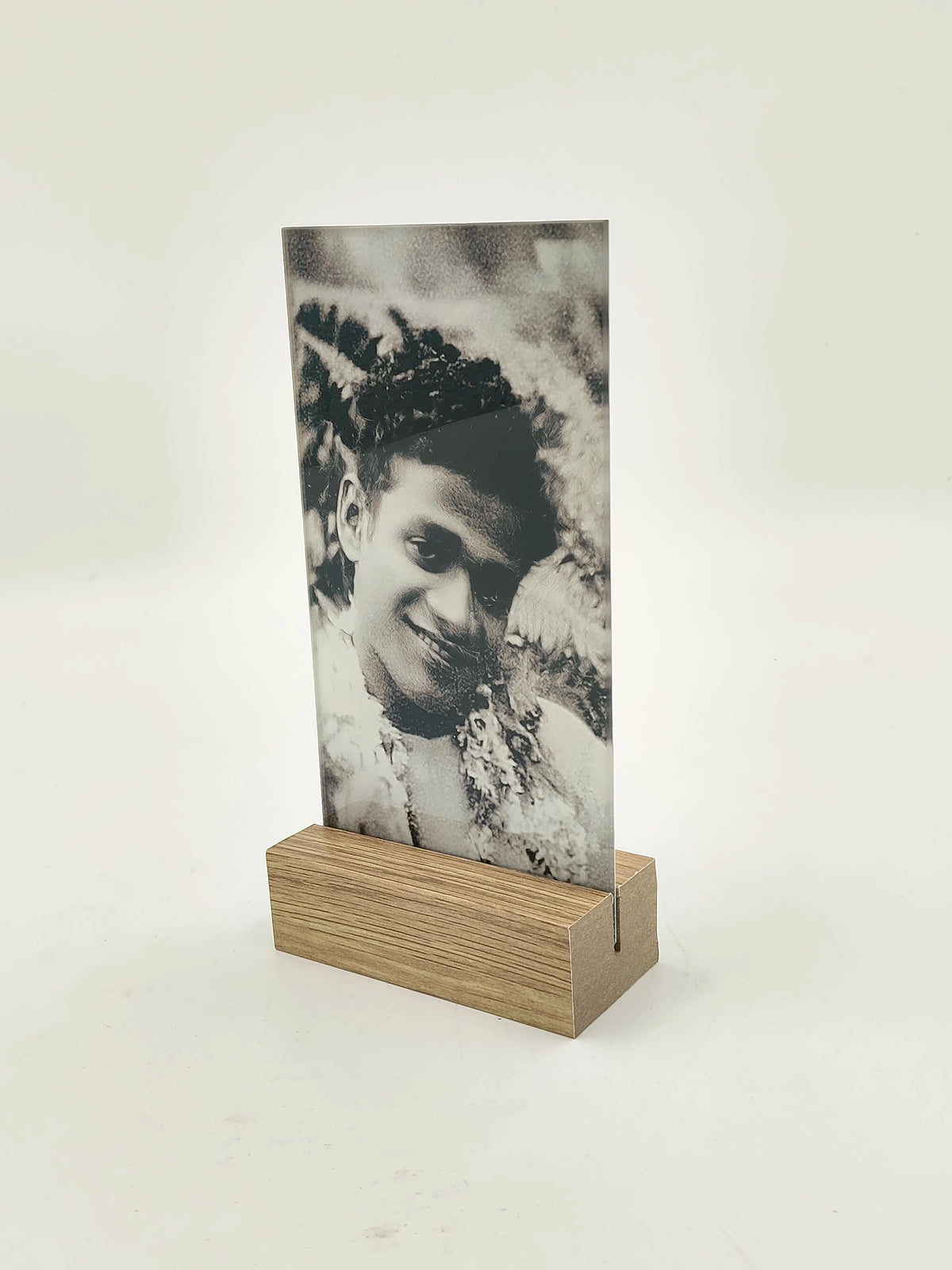 Rectangular glass photo display set in wooden base with black and white portrait