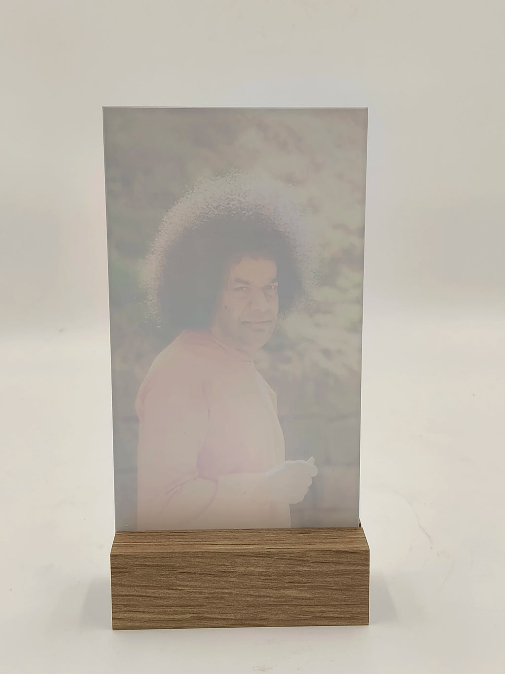 Large glass and wood display stand with spiritual image inside