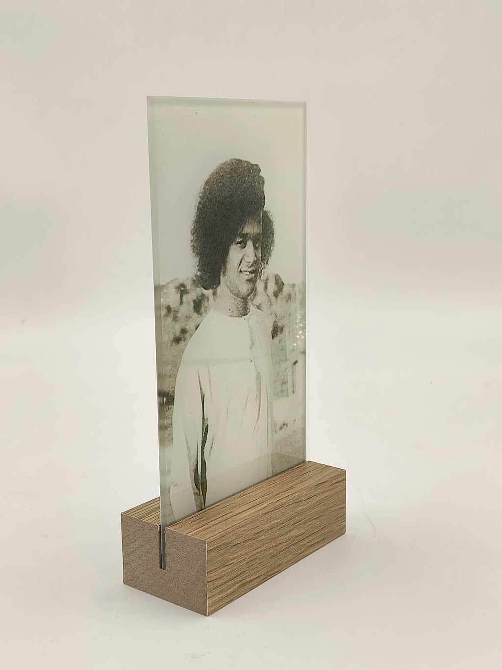 Glass panel with black and white portrait in wooden base display stand