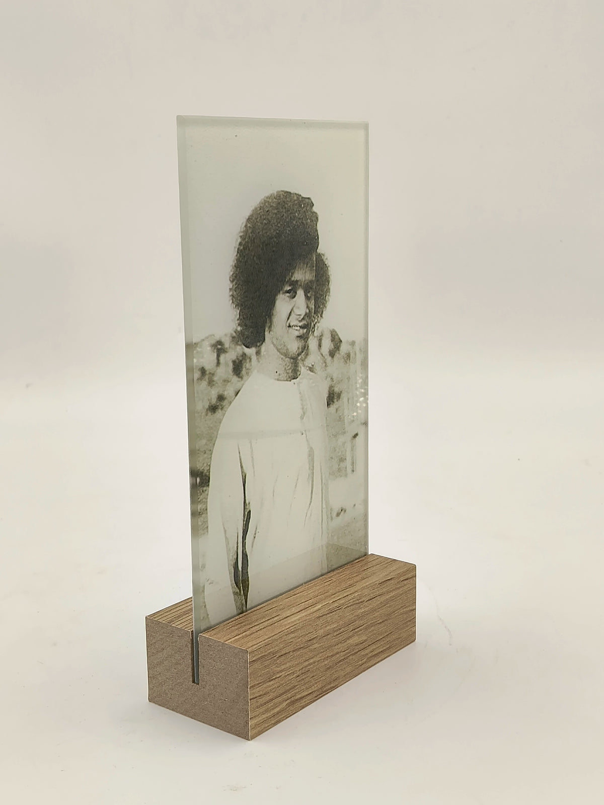 Glass panel with black and white portrait in wooden base display stand