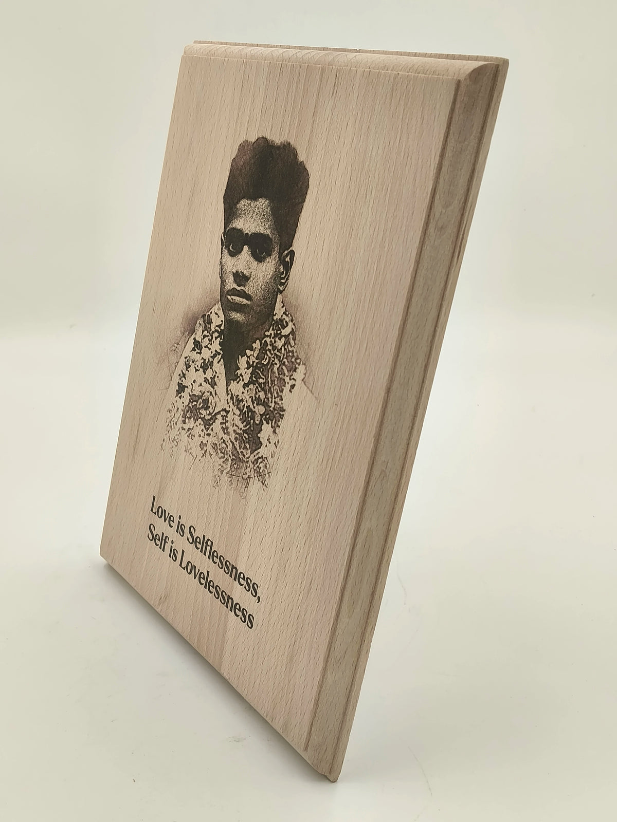 Large wooden plaque with engraved portrait and motivational quote front view