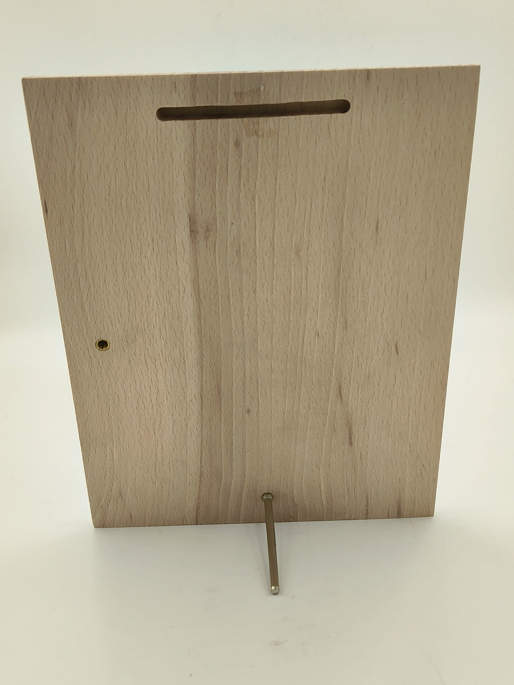Back view of a large wooden plaque with stand and hanging slot