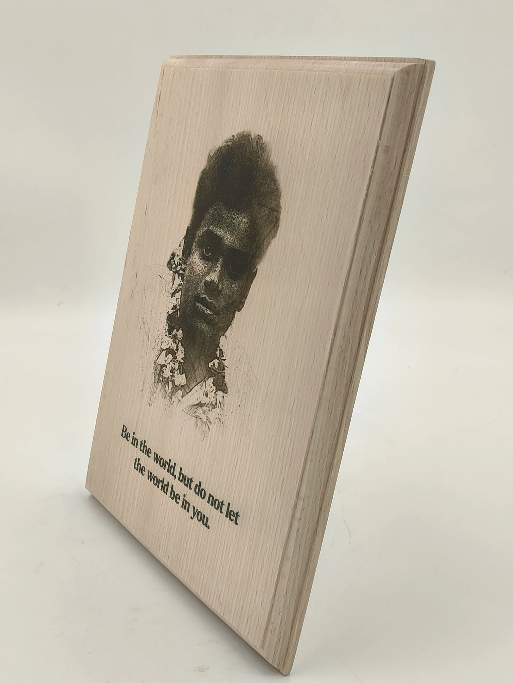 Large wooden plaque with printed portrait and motivational quote